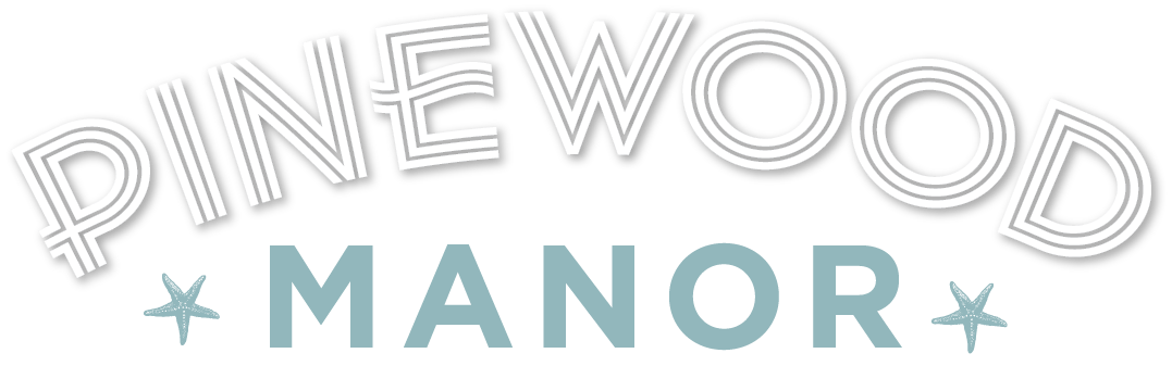 The image displays the text "PINEWOOD MANOR" in a stylized font.